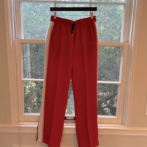 Barbara Bui track pants with elastic waits, side pockets and zippers at ankles.